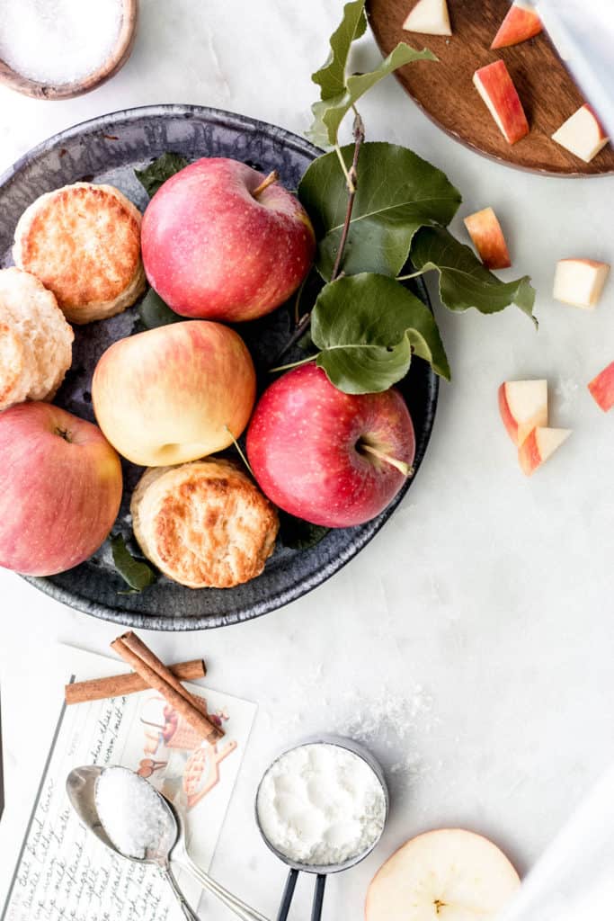 apples on a plate with other ingredients for apple butter