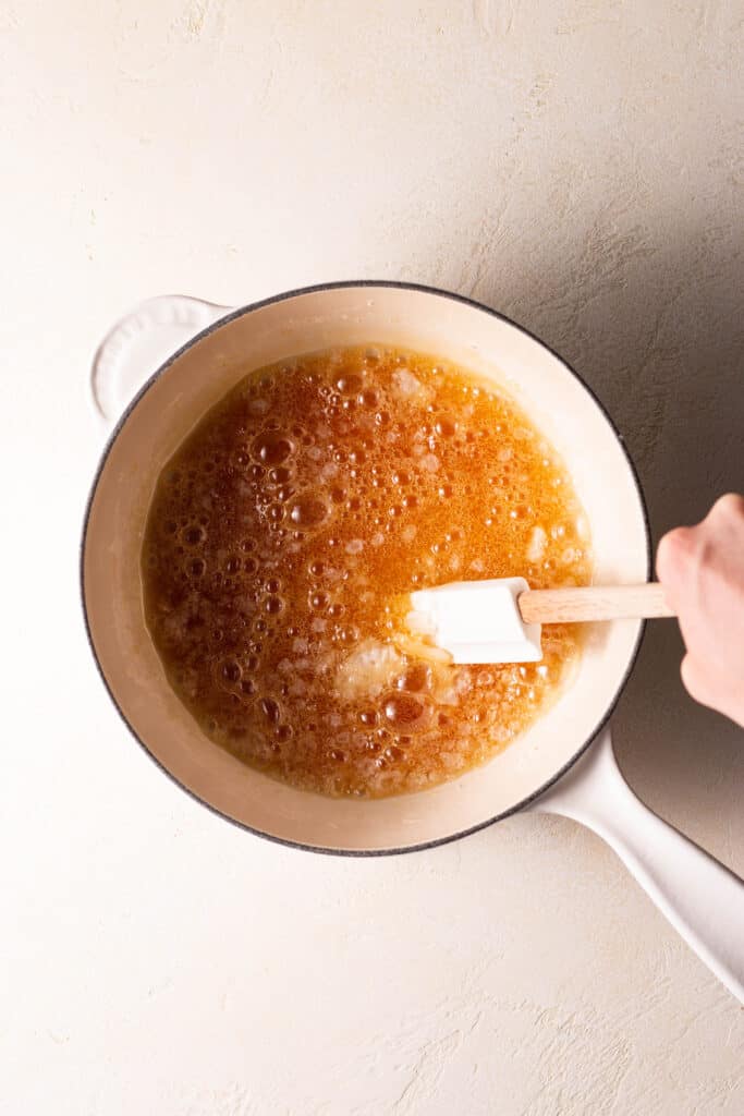 cooking granulated sugar in a saucepan