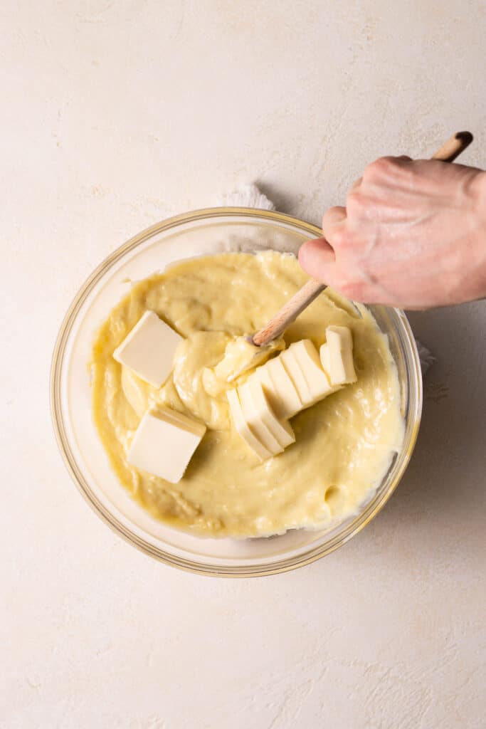 stirring butter into pastry cream