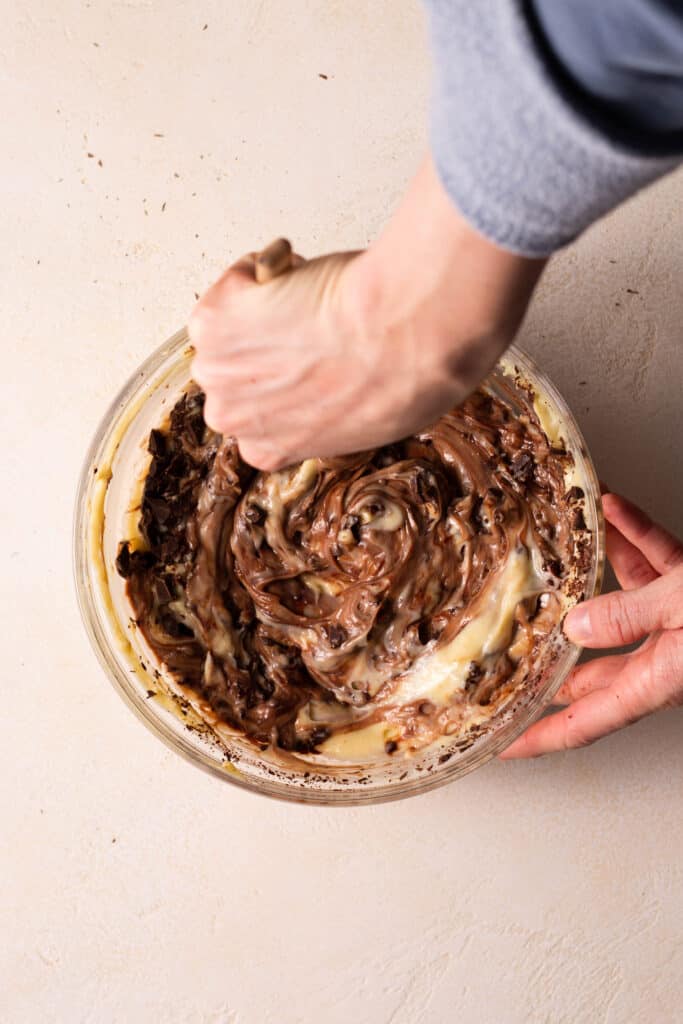 stirring chocolate into pastry cream