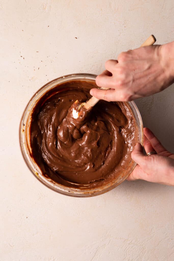 stirring chocolate pastry cream