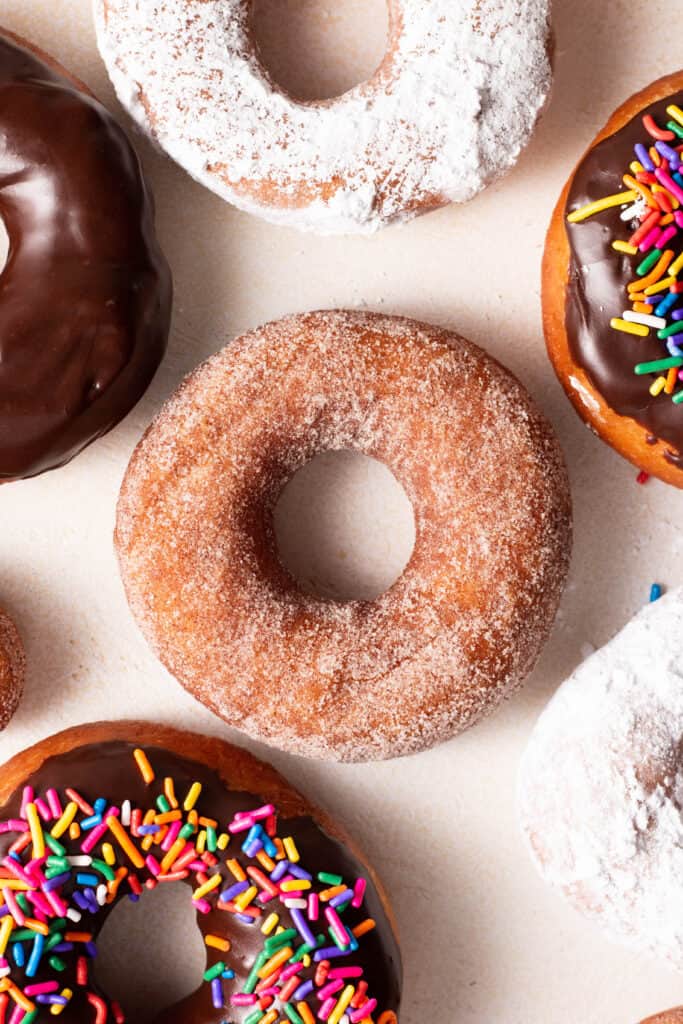 cinnamon-sugar topped yeasted donut on a board.