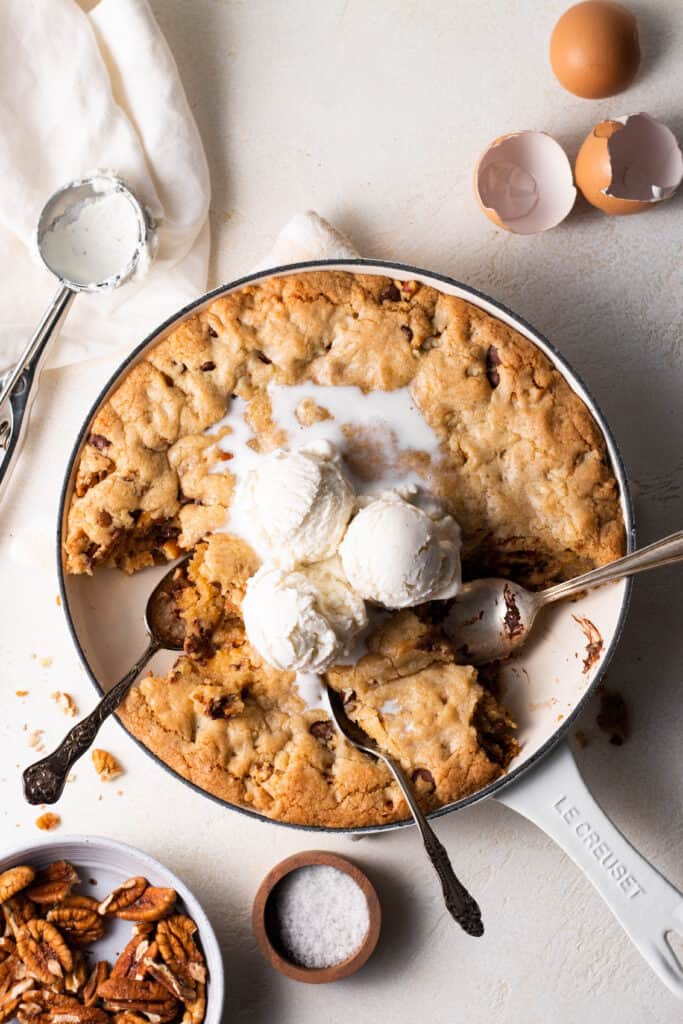 chocolate chip skillet cookie with bites taken out of it