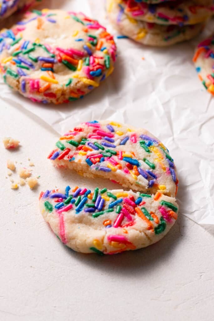 sugar cookie split in half on a board