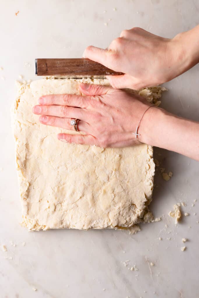 forming buttermilk biscuit dough into a square