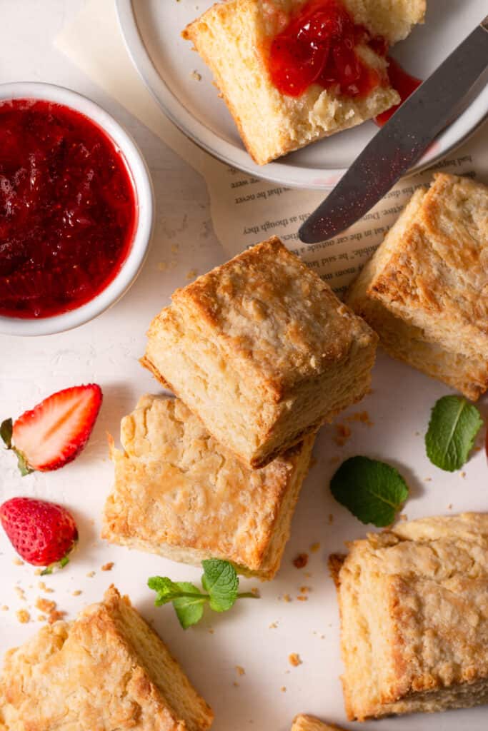 biscuits on a board with strawberry jam