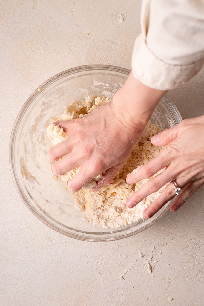 hand mixing homemade pie crust