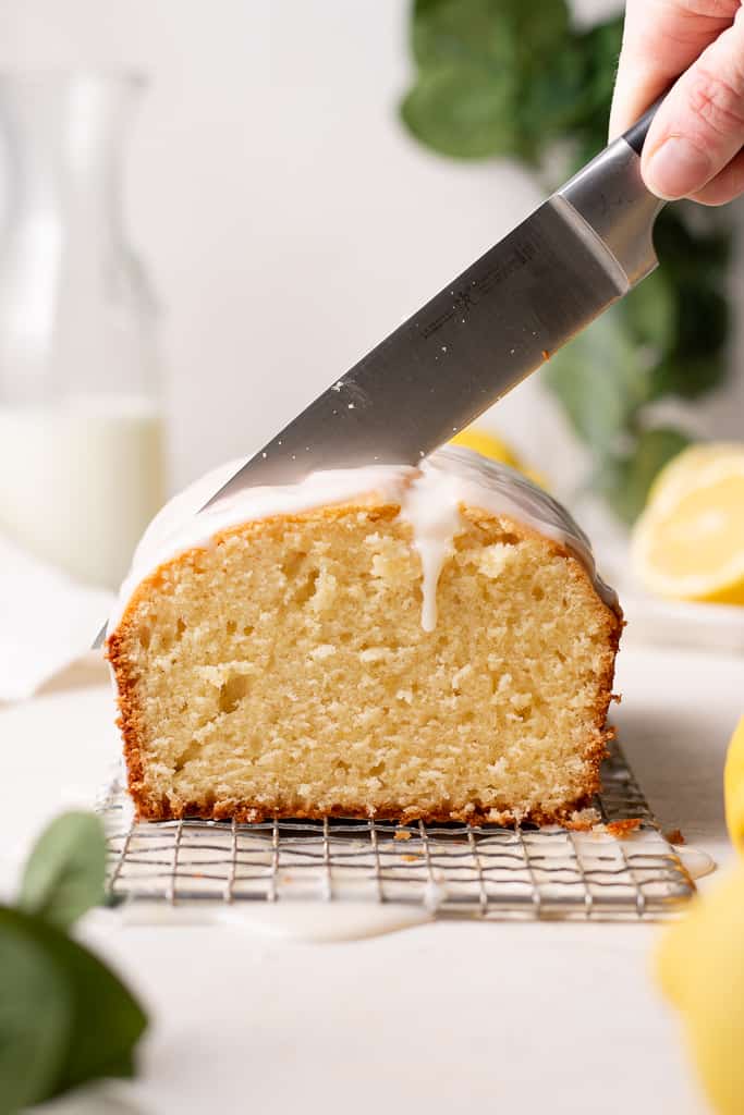 lemon loaf cake being cut in half
