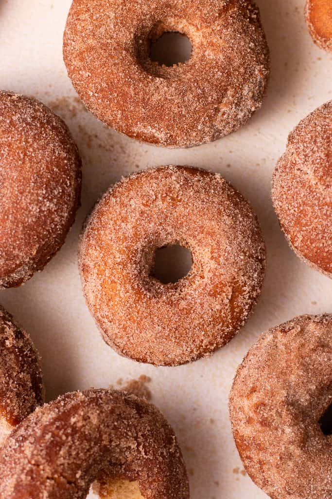 fried apple cider donuts on a board