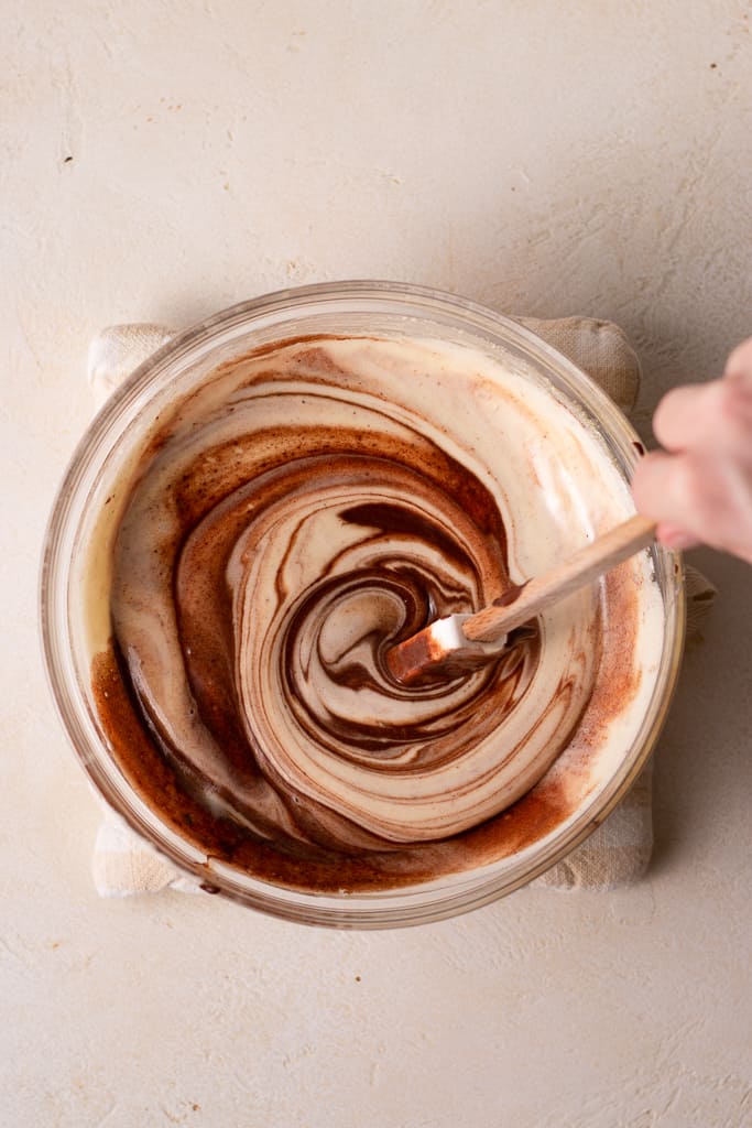 hand stirring chocolate french buttercream