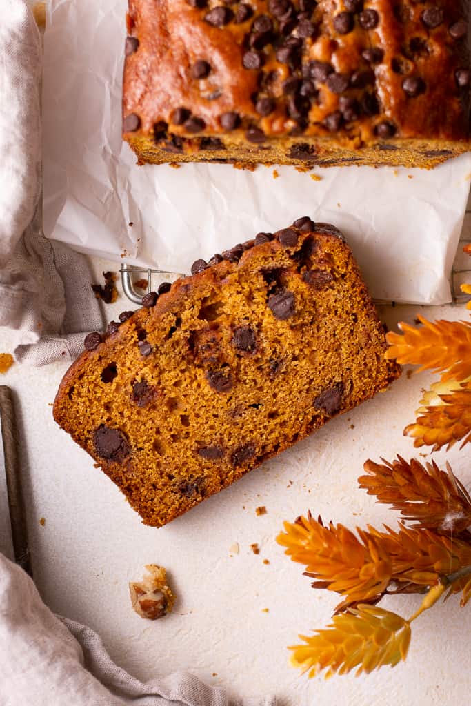 slice of chocolate chip pumpkin bread on a platter