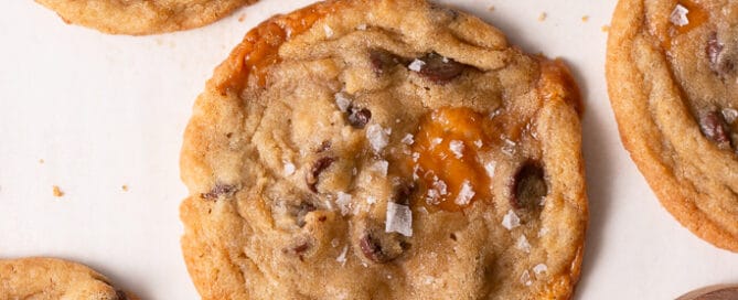 salted caramel chocolate chip cookies on a board