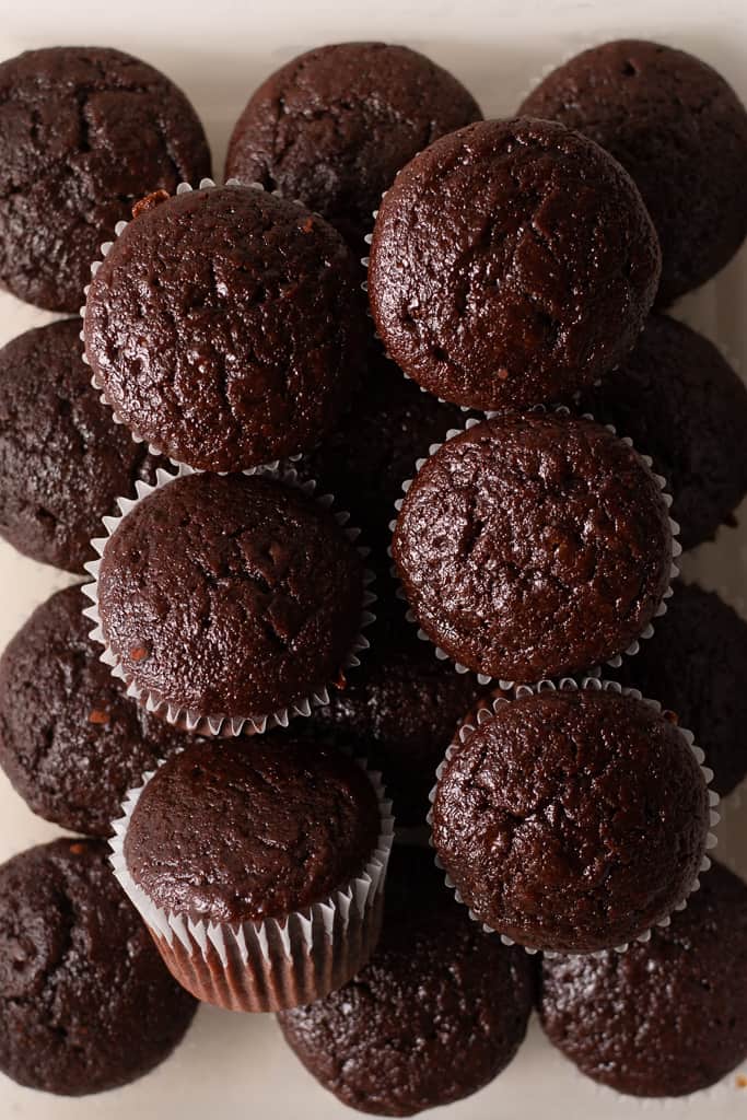 chocolate fudge cupcakes with no frosting stacked on top of each other