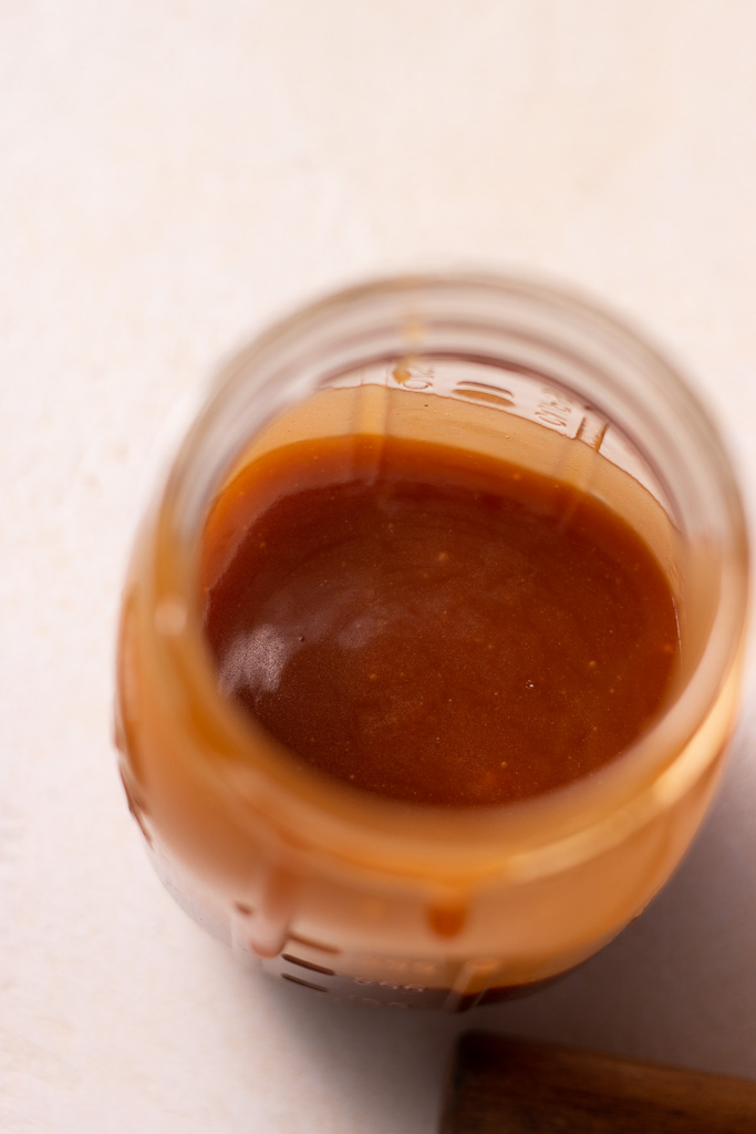apple cider caramel sauce in a mason jar