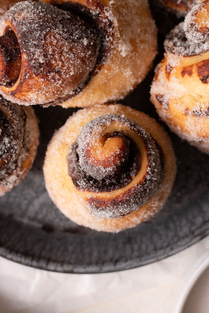 overhead close-up shot of a chocolate sugar bun.