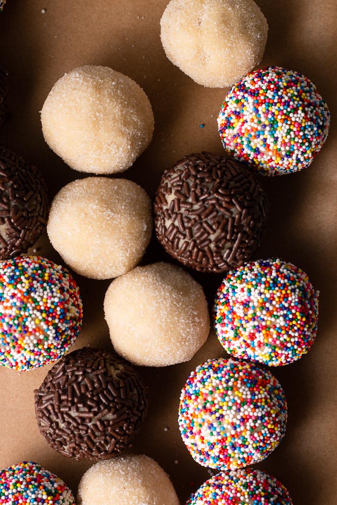 chewy vanilla bean sugar cookie dough balls on a sheet tray.