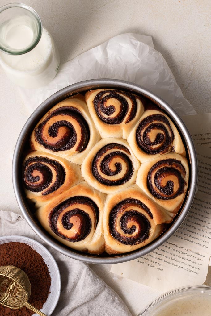 overhead shot of cinnamon rolls in a 9-inch round cake pan.