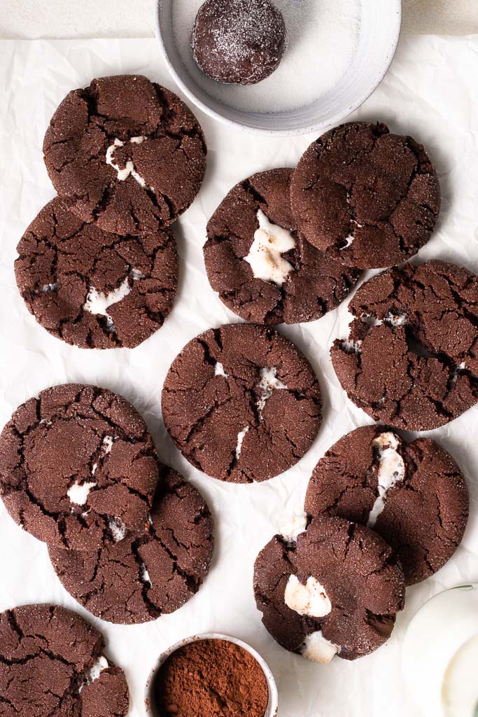 hot chocolate marshmallow cookies on a piece of parchment paper.