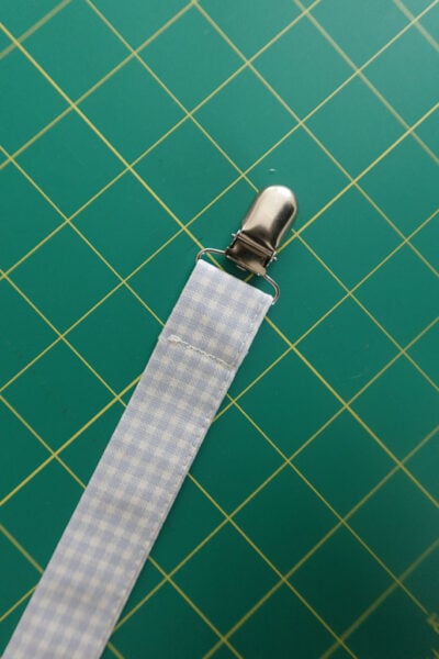sewing the suspender clip in place.