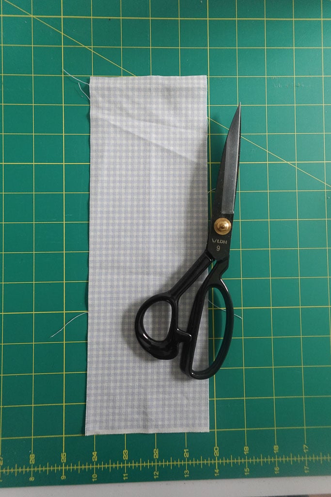 fabric shears and fabric piece.