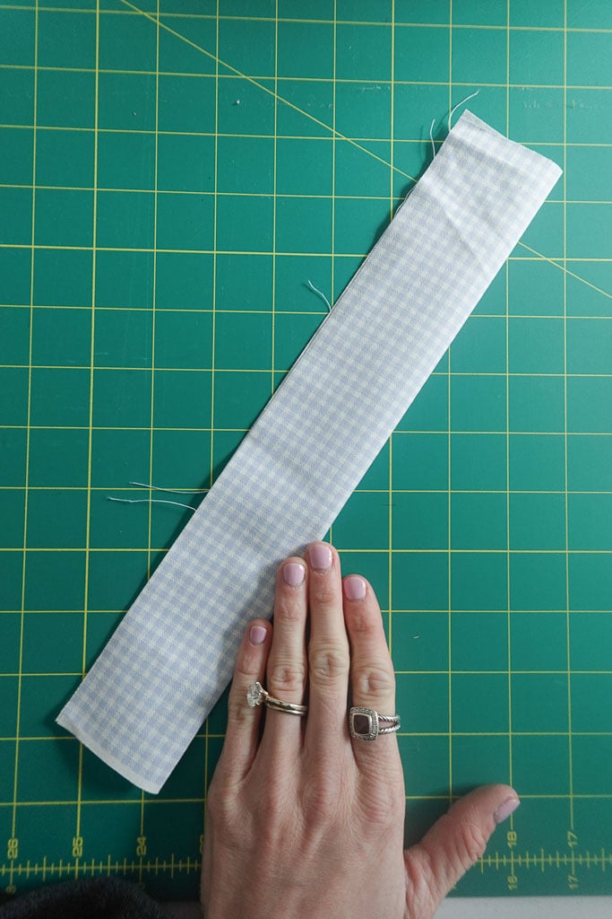 folding fabric in half lengthwise.
