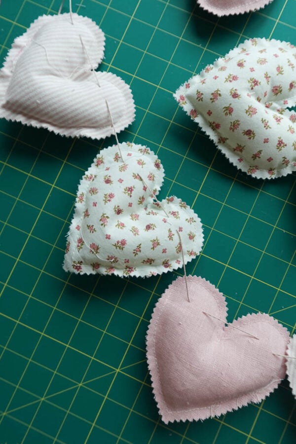 adding embroidery floss to heart garland.
