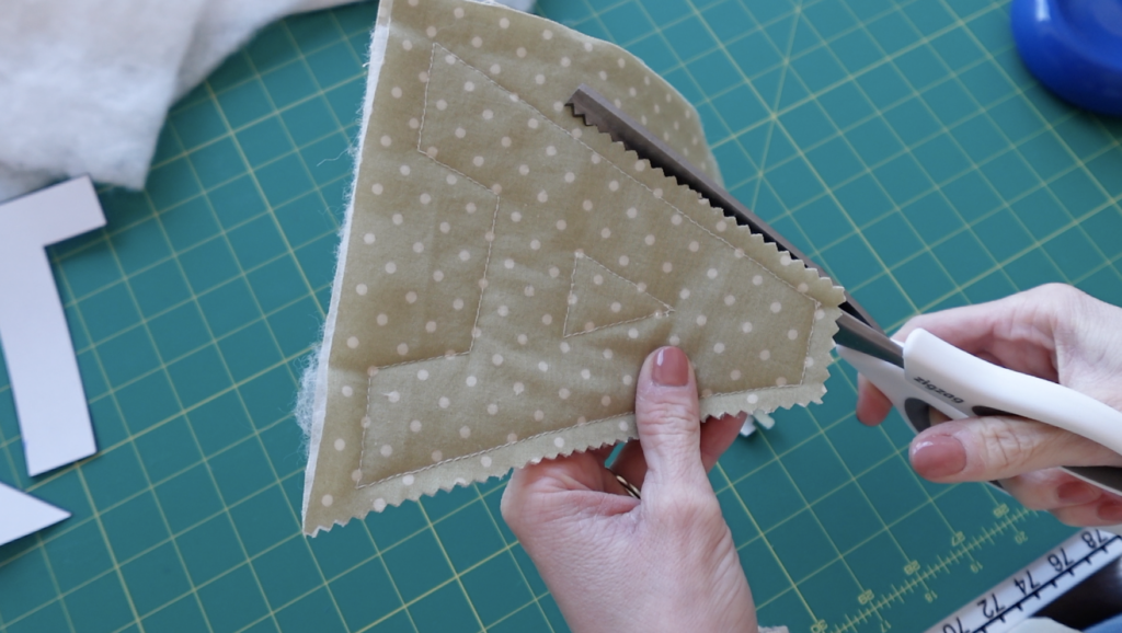 trimming the fabric with pinking shears.