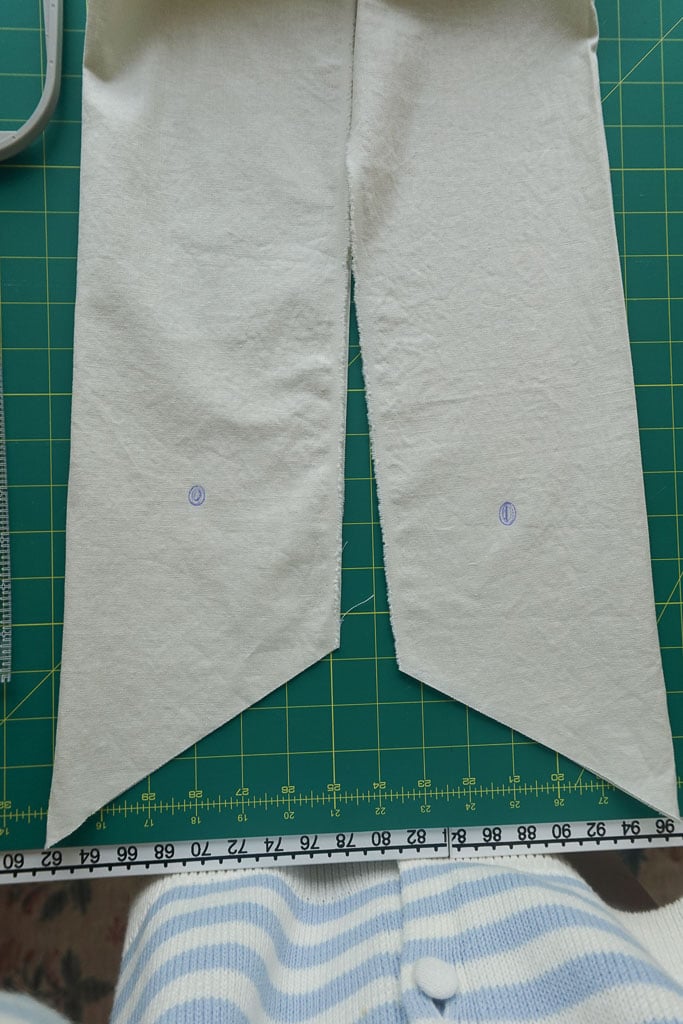 marking where you will embroider the diy wreath sash.