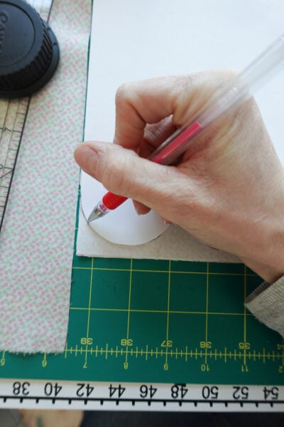 tracing scallops onto fabric.