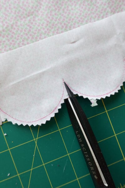cutting into each corner using fabric shears.