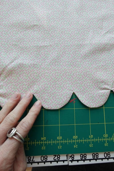 pressing the scallop shapes flat.