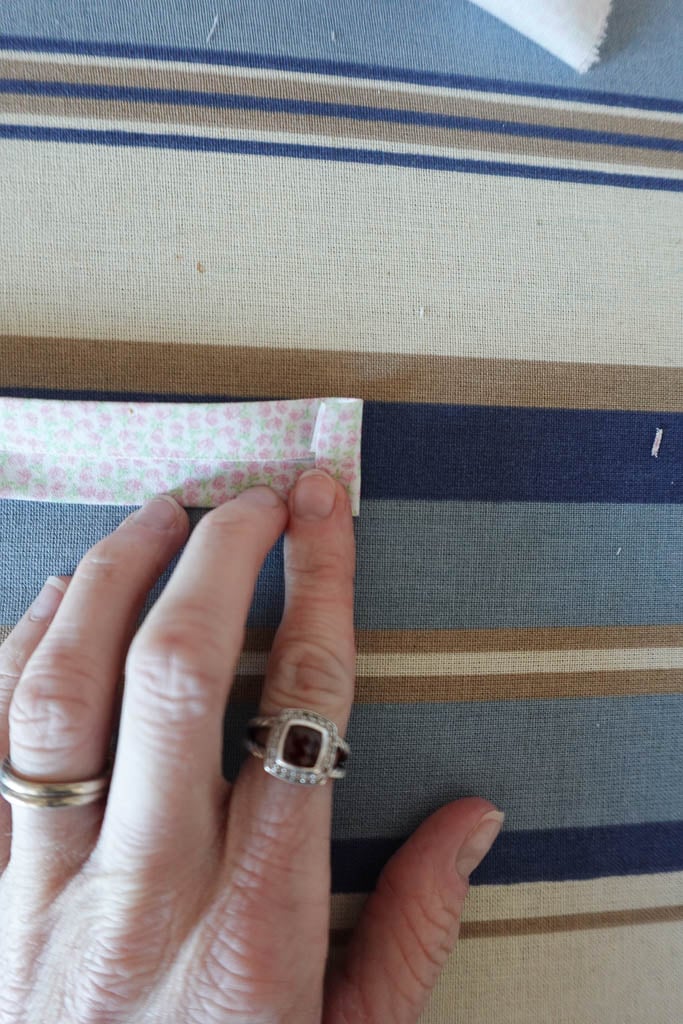 folding the bias tape short ends.