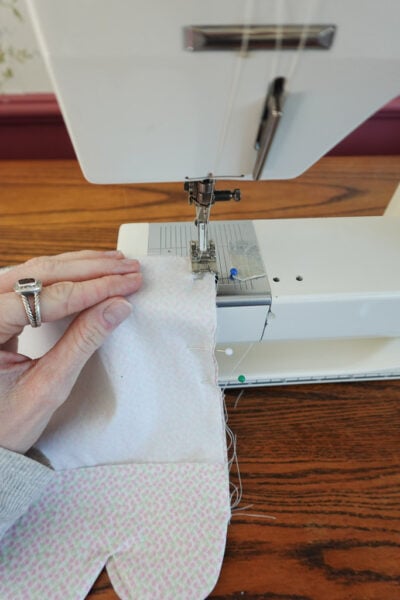 sewing pieces basket liner pieces together.