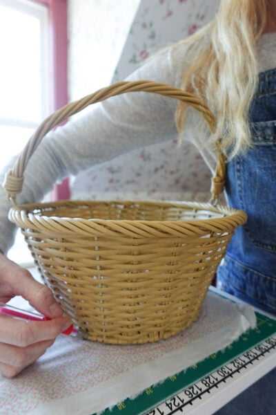 tracing the base of the basket onto a piece of fabric.