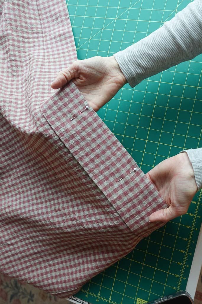 sewing the rod pocket on the curtain.