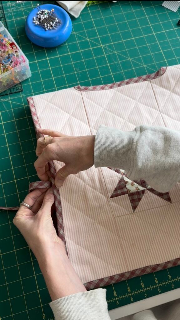 adding binding to sewing machine cover.